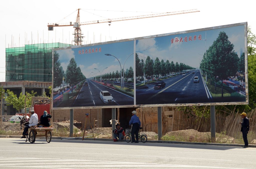 21 Donkey Cart Next To Advertising For Cars On New Paved Roads In Karghilik Yecheng At The Junction Of China National Highways 315 And G219